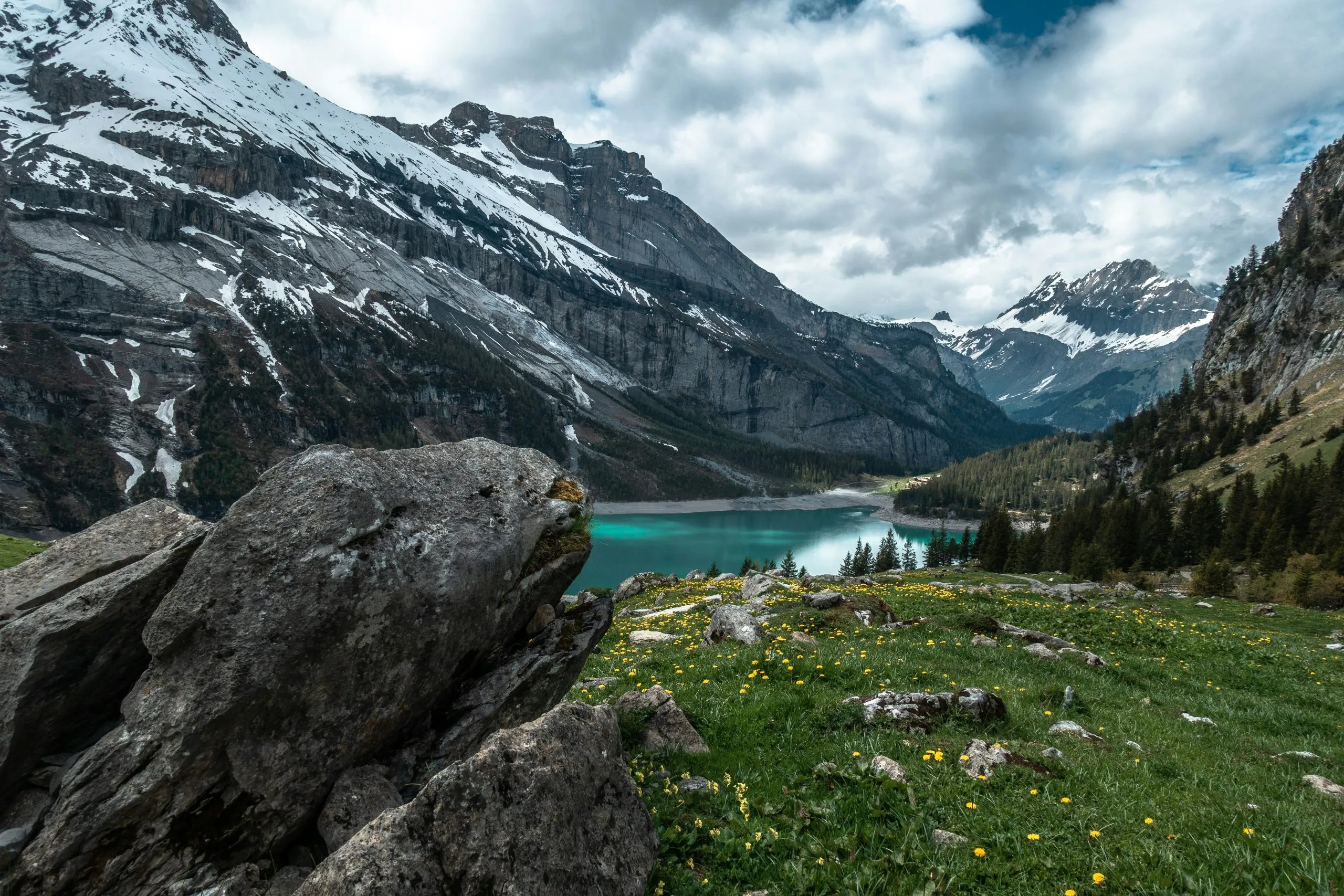 DelightVacations Switzerland tour showcasing beautiful Alps mountains, clear blue lake, and scenic European landscape perfect for holiday packages